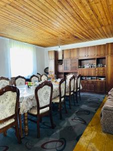 a dining room with a table and chairs at Uruyat Nomad guesthouse in Naryn
