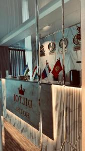 a reflection of a lotto kitchen in a glass window at Diltoj Hotel Tashkent in Tashkent