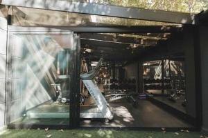 a gym with bikes parked inside of a building at Pousada Murano in Campos do Jordão