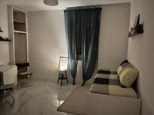 a living room with a couch and a window at Leonardo Loft in Filettino +3 photos