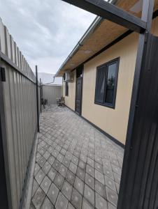 a patio outside of a house with a fence at Erevanyan House in Pʼarakʼar