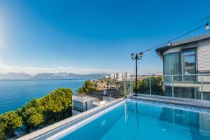 a view of the water from a house with a swimming pool at Massimo Hotel - Adults Only 'Ex La Boutique Hotels' in Antalya