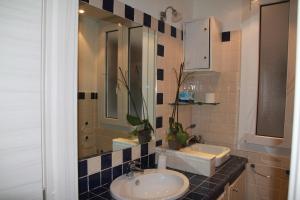 a bathroom with a sink and a mirror at Profumi di mare Resort in La Spezia
