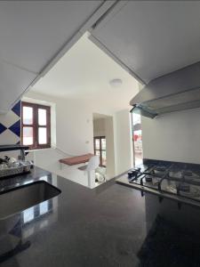a kitchen with a stove top oven in a room at Sherezade Riad in Tétouan