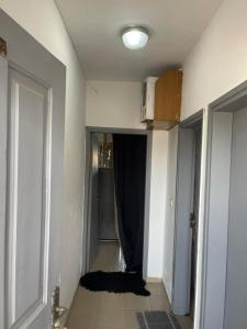a room with a hallway with a curtain and a door at Studio Angre Mahou in Cocody +2 photos