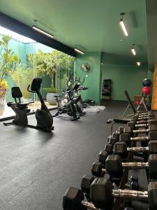 a gym with rows of exercise bikes in a room at Apartamento Moderno Cosmopolitan Tower in San José +13 photos