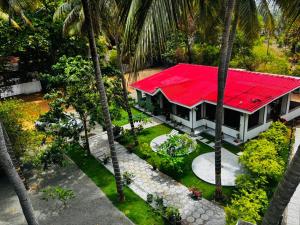 an aerial view of a house with a red roof at Secret Garden Beach Hotel in Trincomalee
