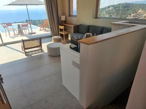 a living room with a view of a living room at Alos Suites in Verga Kalamata