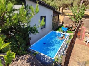 an overhead view of a swimming pool in a backyard at Paradise on the horizon in El-Rom
