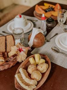 a table with a plate of bread and other foods at Zen Spa Caraíva in Caraíva +54 photos