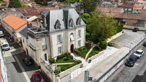 an aerial view of a white house with a yard at Logis Hôtel Beauséjour in Chauvigny