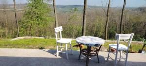 a table and two chairs and a table and a table at Kosmaj - Sopot in Sopot