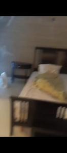 a blurry picture of a bed with avertisement at دوار الهلال دوار الثقافه in Irbid