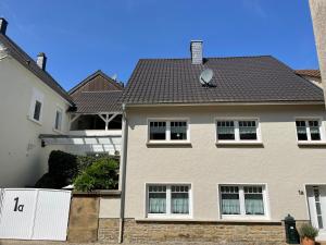 a large white house with a roof at Haus 1a in Lauterecken