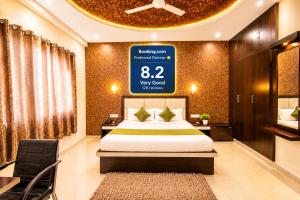 a bedroom with a bed and a large sign on the wall at Hotel Star Palace -Affordable Premium Rooms Near Taj mahal in Agra +16 photos