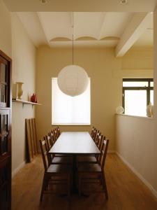 a dining room with a table and chairs at Casa Reina Cabanyal in Valencia
