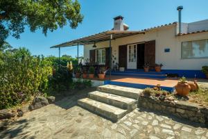 a house with steps leading up to it at Monte Pedras Negras in São Luis