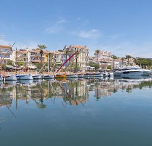 a group of boats are docked in a harbor at Studios Riviera in Bandol