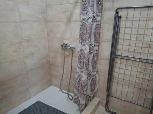 a shower with a shower curtain in a bathroom at Salamina Sea View in Kakí Vígla +26 photos