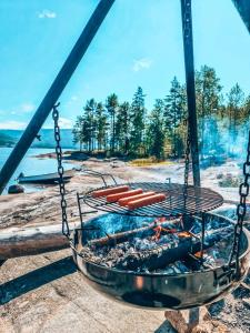 a grill with a bunch of hot dogs in it at Chalet Vradal in Vradal