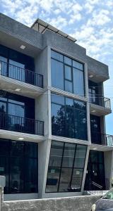 a large building with balconies on the side of it at TheStarryNight in P'ichvnari