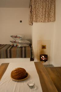 a cake on a table in a room with a fireplace at Екопоселення Верболози in Misaylovka +68 photos