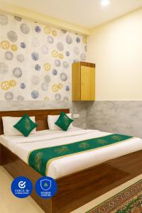 a bedroom with a large bed in a room at Hotel Grand RK Residency Rukmani Vihaar - #PremManir #Chaar Dham #Parking #Affordable Stay in Vrindāvan