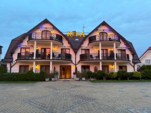 a building with a sign on the front of it at Reda in Rowy