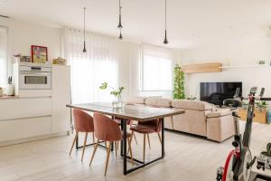 a kitchen and living room with a table and chairs at Duplex in Durango's old town in Durango
