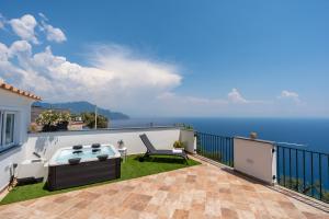 a balcony with a view of the ocean at Santa Rosa Relais in Conca dei Marini