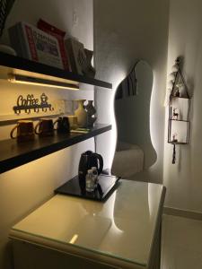 a room with a table with a tea kettle on it at شقه in Ar Rass