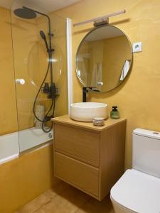 a bathroom with a sink and a mirror at El rincón de la Rapeda in Villanúa +14 photos