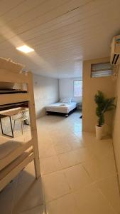 a bedroom with a bunk bed in a room at Brisa Mar in Fortaleza