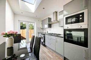 a kitchen with a table and a stove top oven at Two bedrooms apartment in Wainscot