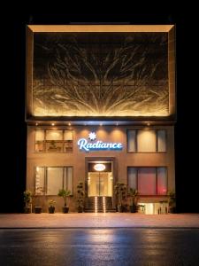 a building with a sign on the front of it at Radiance Hotel in Sirsa