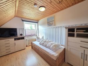 a bedroom with a bed with white pillows on it at Ferienwohnung Ufen in Hage
