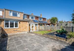 a backyard of a brick house with a fence at DD Private Double Room with Shared Bathroom in York