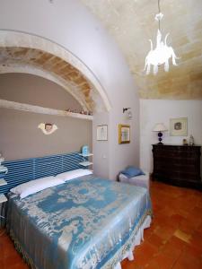 a bedroom with a large bed in a room at Corte dei Venti in Matera