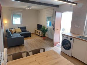 a living room with a couch and a table at Sweet Hill Bilbao in Bilbao