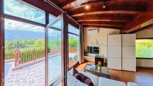 a living room with a view of a balcony at Indiana Boutique Hotel in Llanes