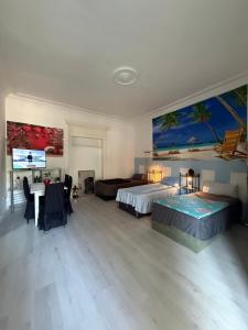 a large bedroom with two beds and a tv at Ferienzimmer Healing und Montuerwohnung in Weißenfels