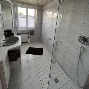 a bathroom with a shower and a sink at Casa-Heckl in Tutzing +14 photos