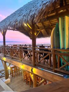 a table with surfboards on top of it on the beach at Costa Catalina in Santa Catalina