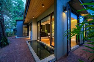 an external view of a house with a fish tank at The Plunge by Duo Escapes in Gonahena