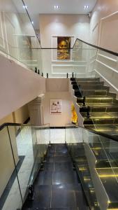 an escalator in a museum with a glass floor at X-ones place command in Meran