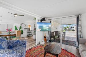 a living room with a couch and a table at Bonnet Sea Cottage on the water- LIV Resort in Port Isabel