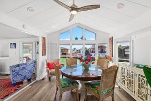 a dining room with a table and chairs at Bonnet Sea Cottage on the water- LIV Resort in Port Isabel