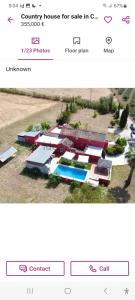 a page of a website with a picture of a house at La Finca Roja 3 in Coín