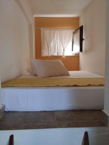 a large bed in a room with a window at Perfect View House in Sotír