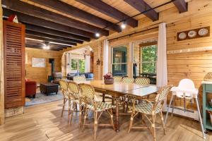 a dining room with a table and chairs at Amazing All-Season Sprucewold Cabin w/ Private Beach Club Access Dog-friendly in Boothbay Harbor +20 photos